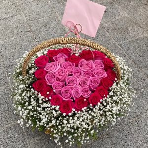 red pink roses basket